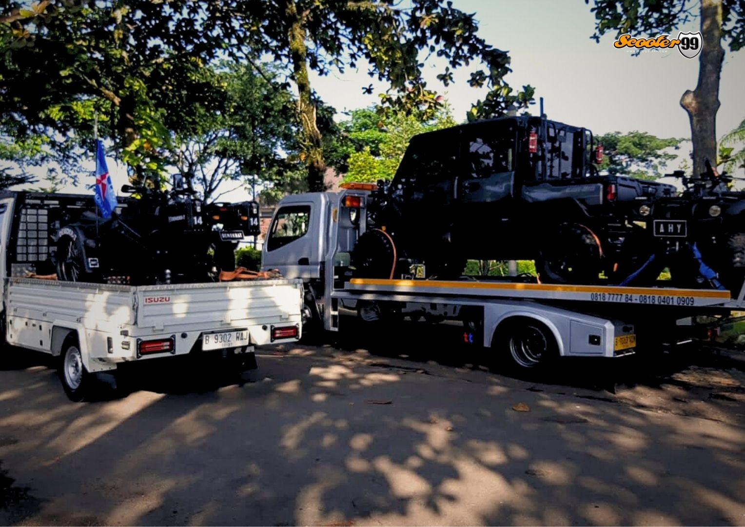 Towing truck in action, securing a vehicle on the roadside